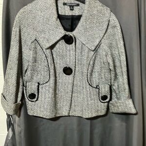 Swing jacket with faux leather piping and large button detail. Size 2